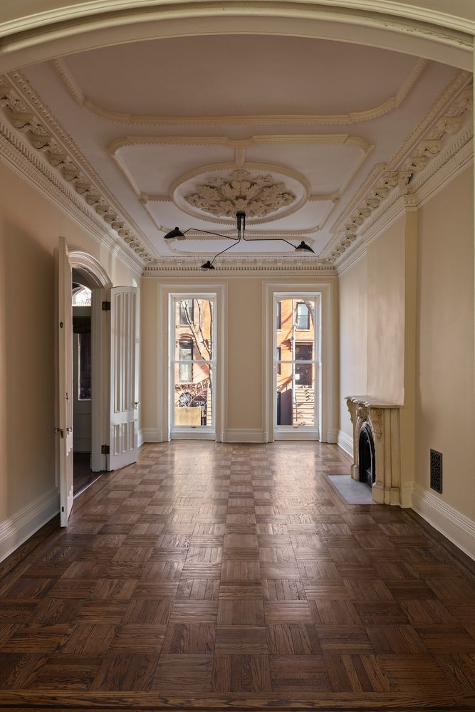 parlor with plasterwork, mantel