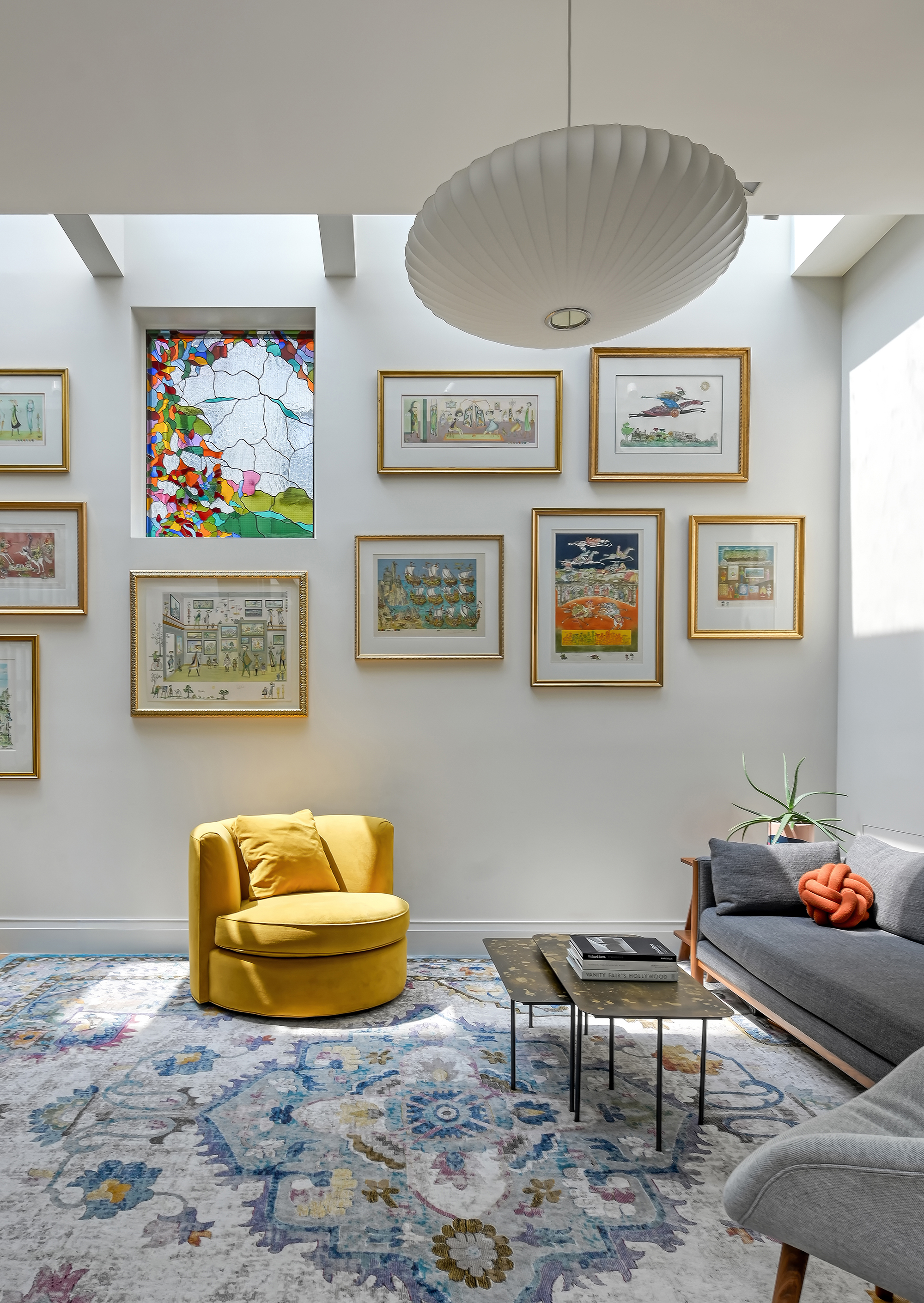 LIVING ROOM WITH YELLOW CHAIR SALON STYLE ART NELSON BUBBLE LAMP