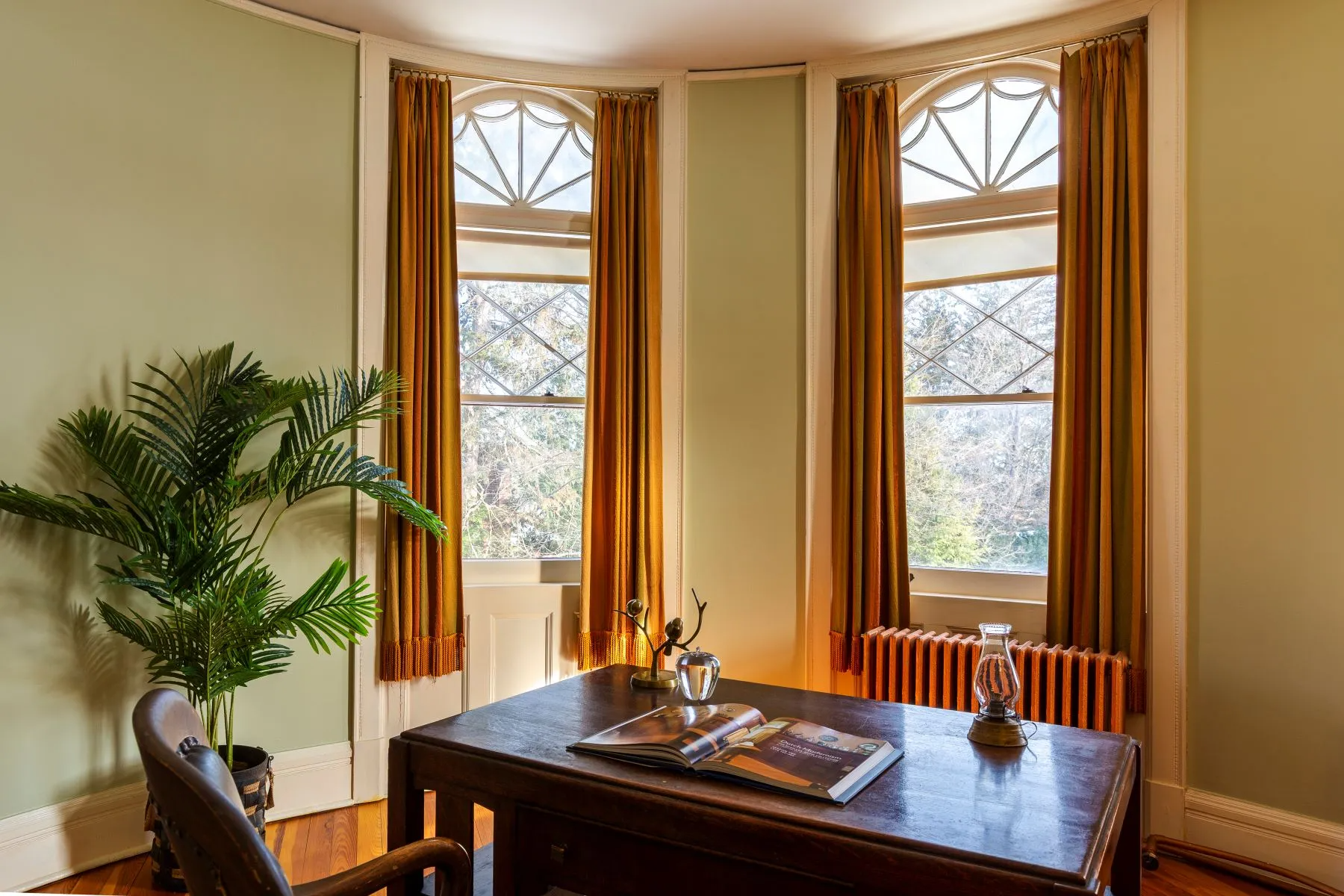bedroom with rounded bay set up as an office