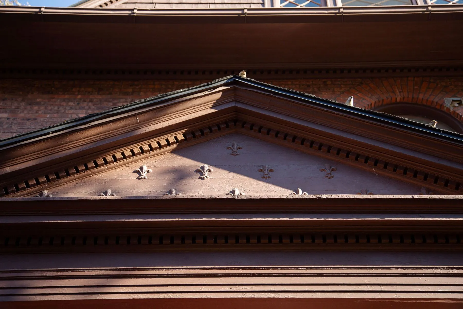 exterior detail with fleur de lis ornament