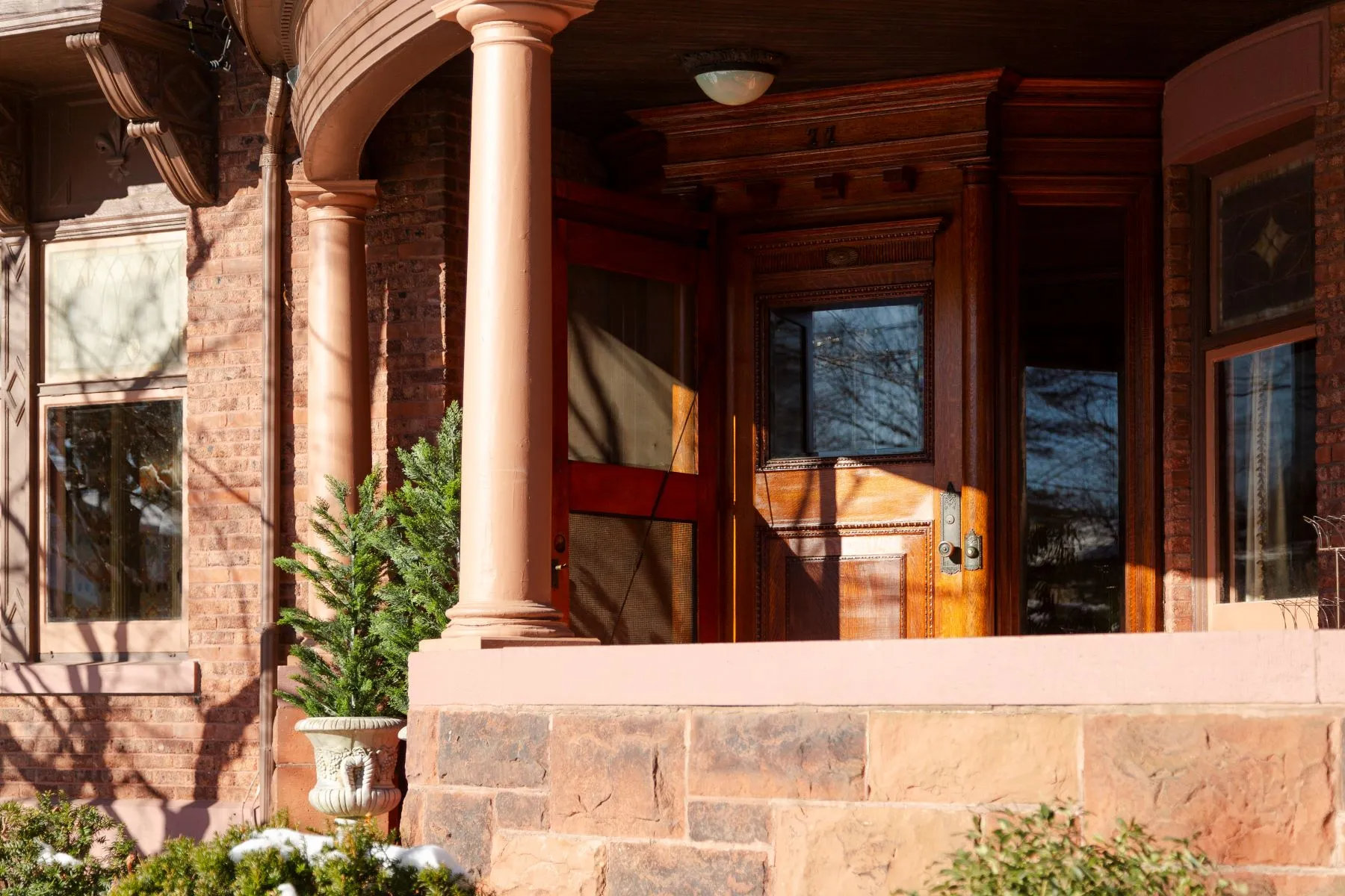 columned porch with view to front door