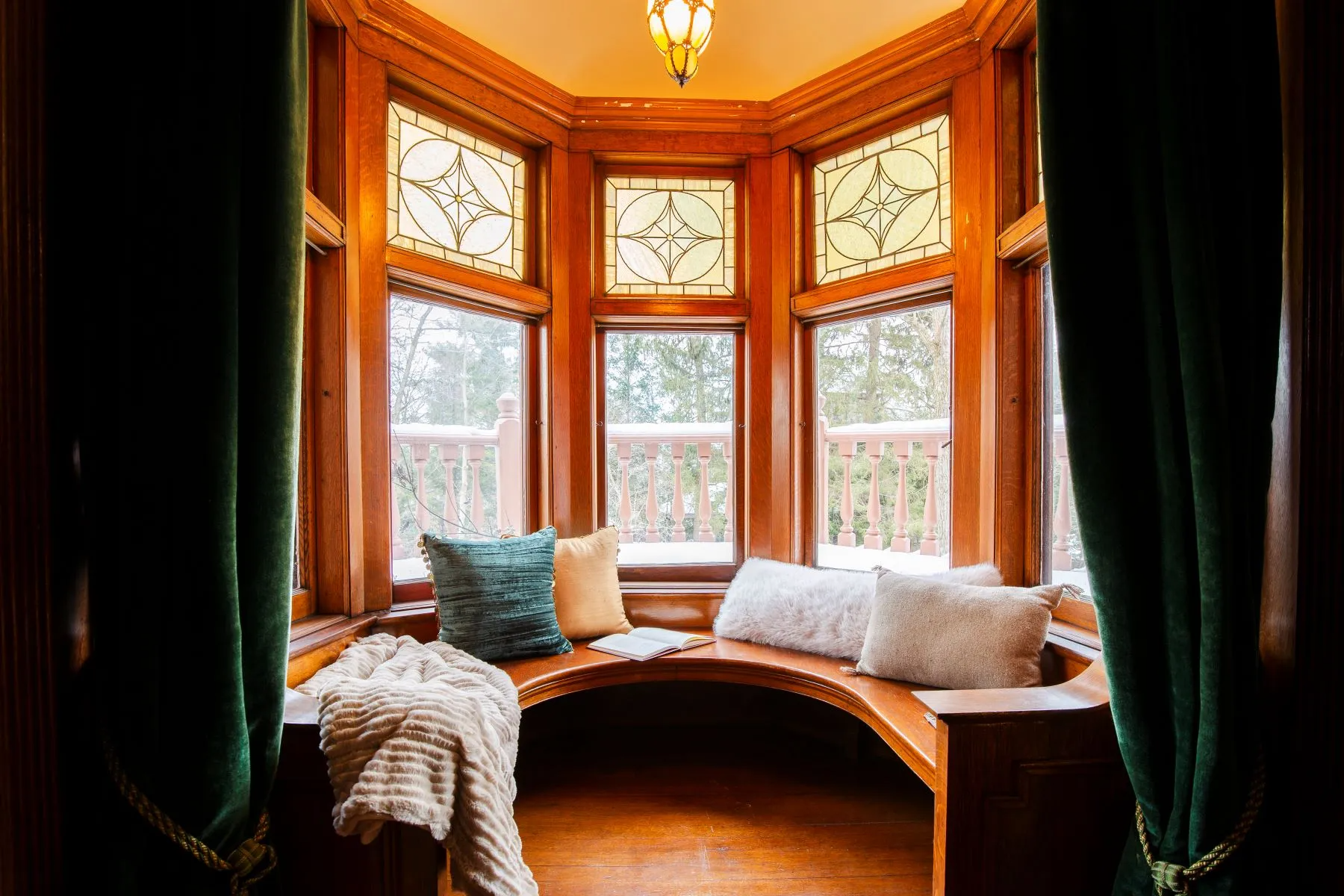 stair landing with a curved window seat