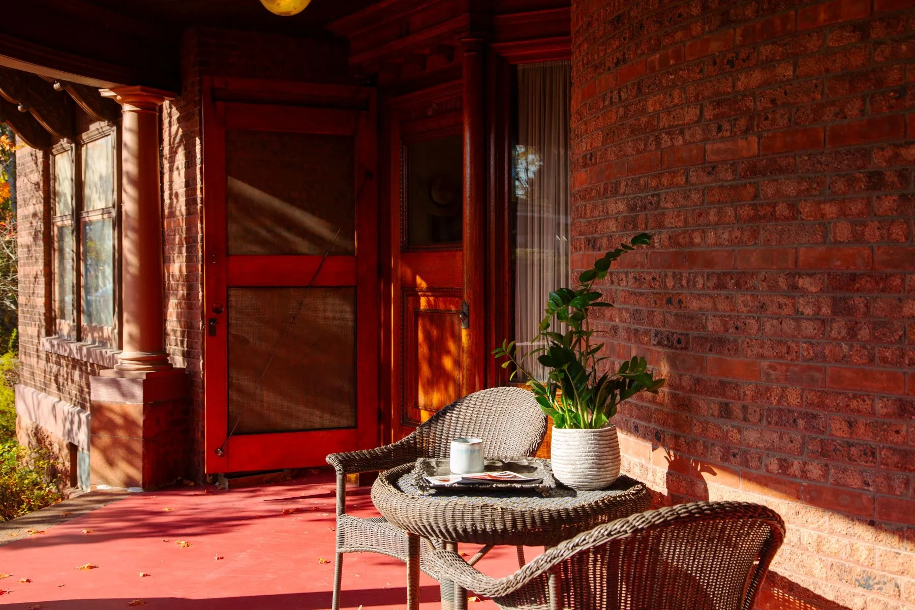 front porch with wicker furniture