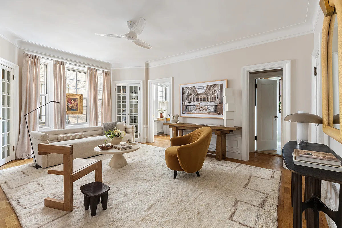 living room with built-in storage, wood floor