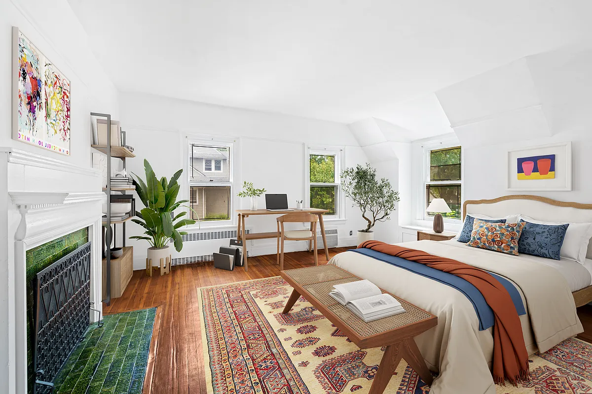 virtually staged bedroom with mantel, room for a desk