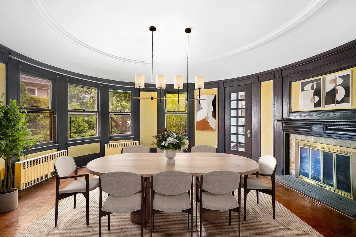 virtually staged oval dining room with mantel