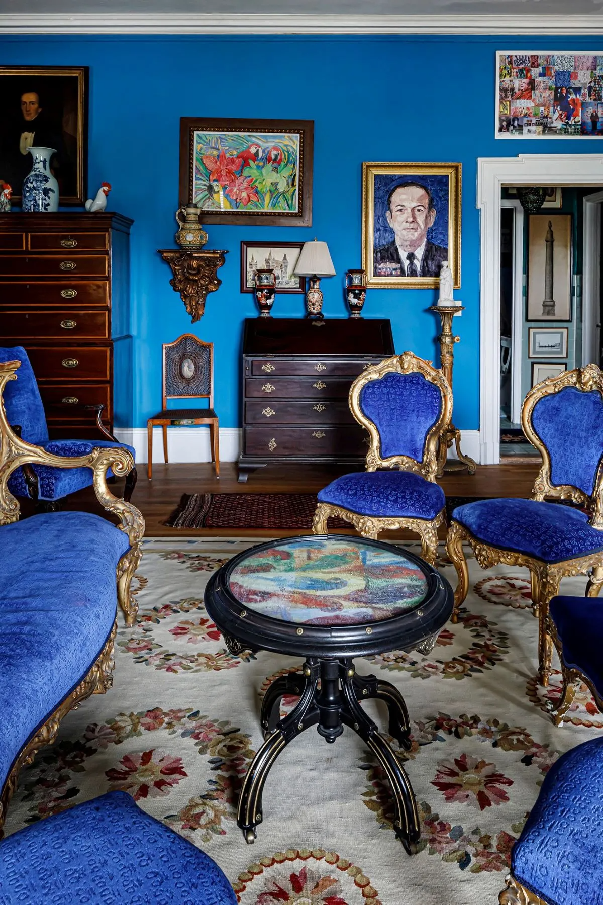 room with bright blue walls and upholstery