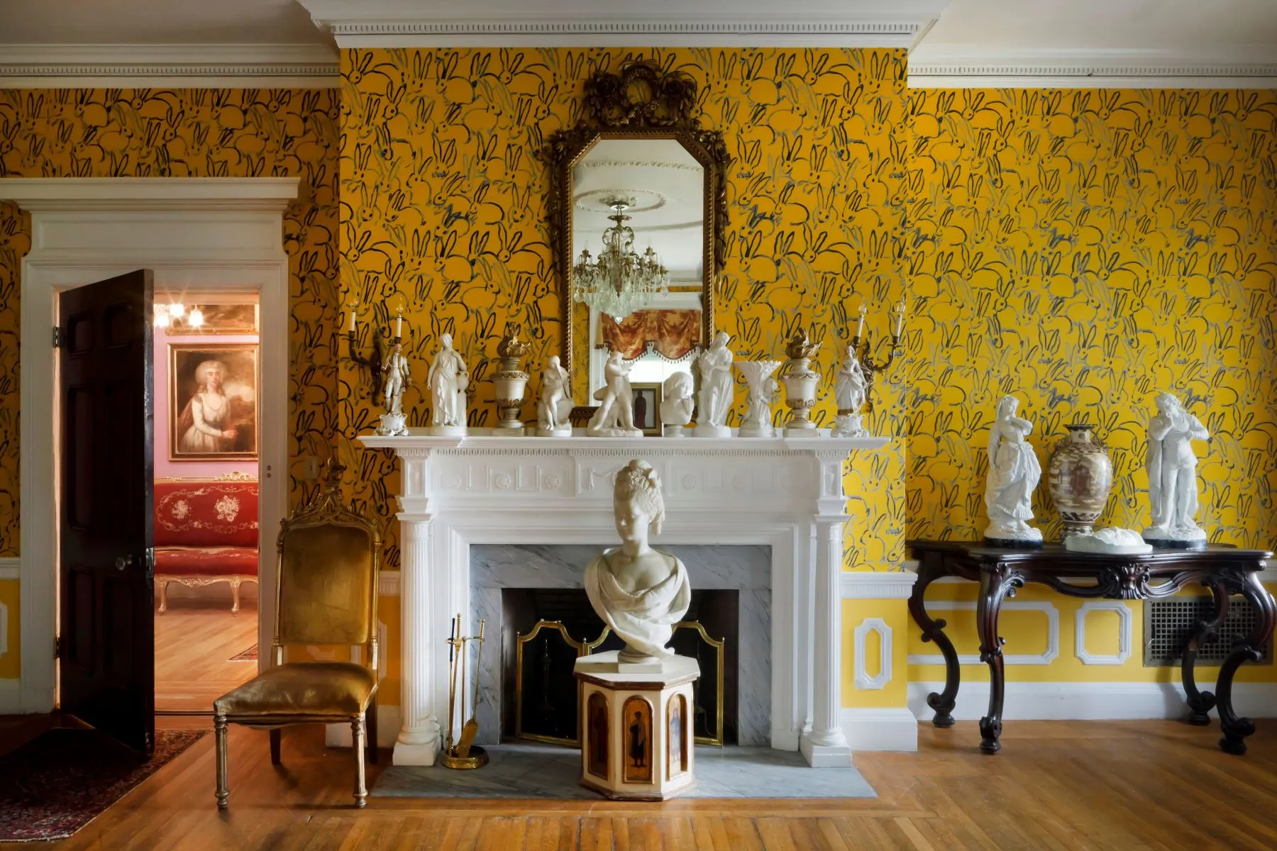 bedroom with yellow bunny wallpaper, a white mantel
