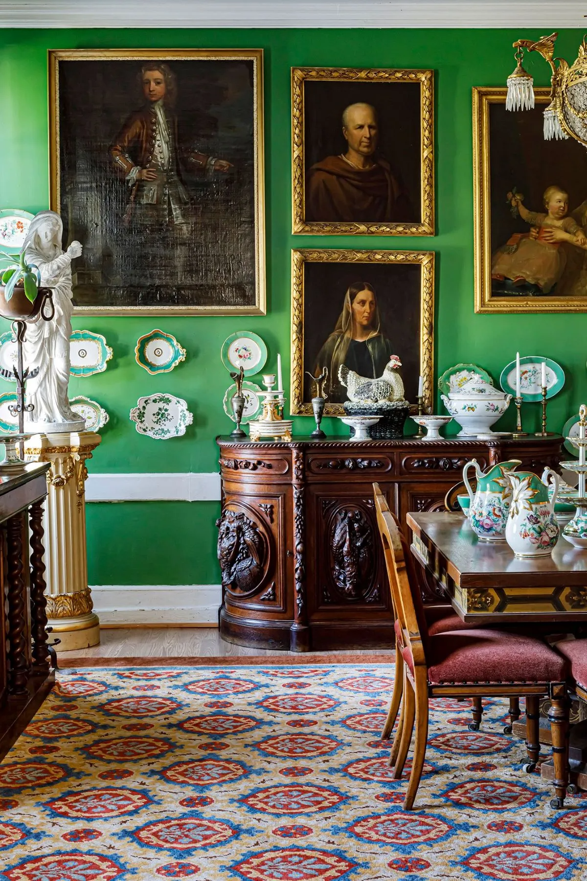 dining room with bright green walls, white trim