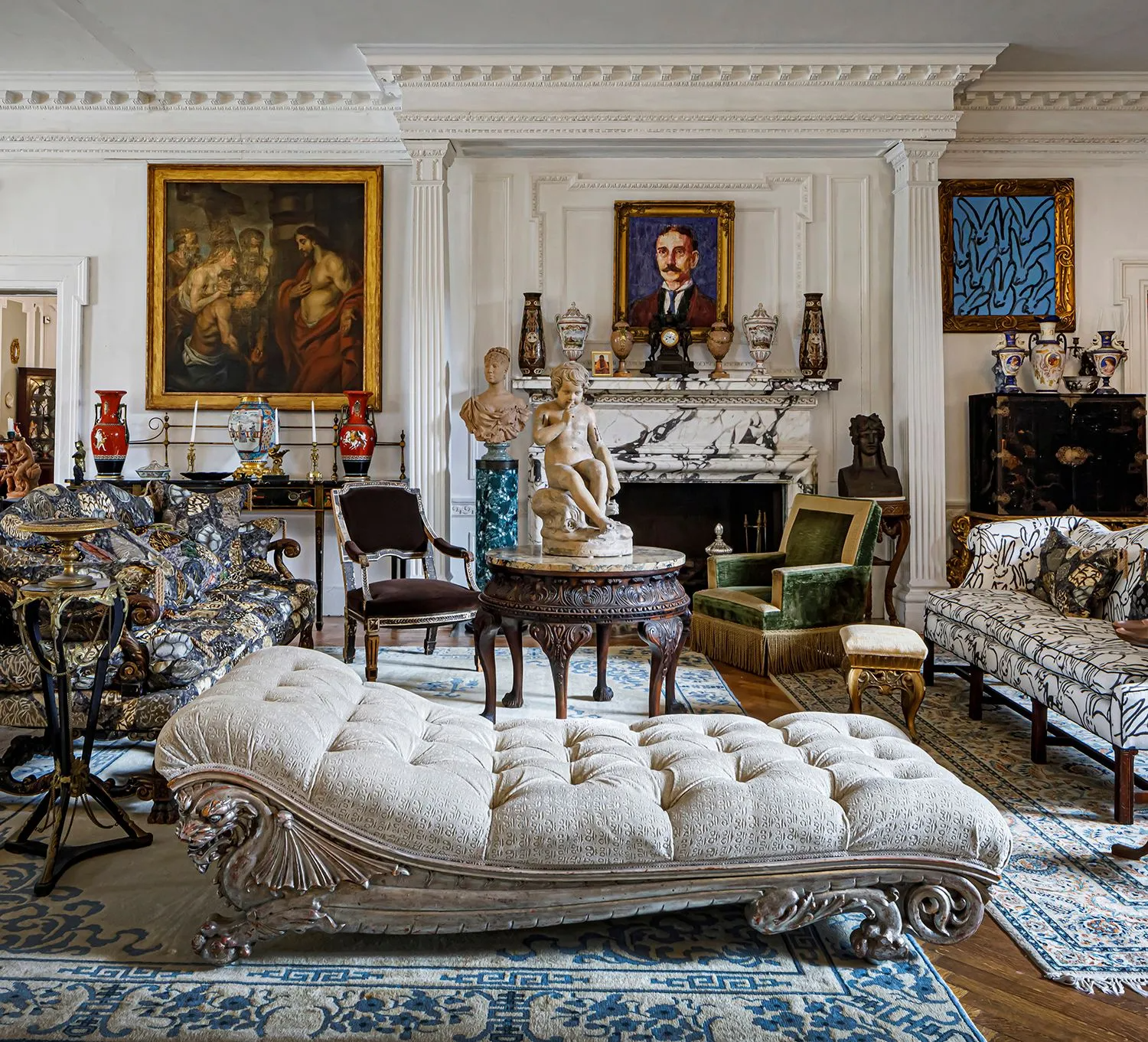 grand entry hall with multiple seating areas, plasterwork, wood floor, mantel