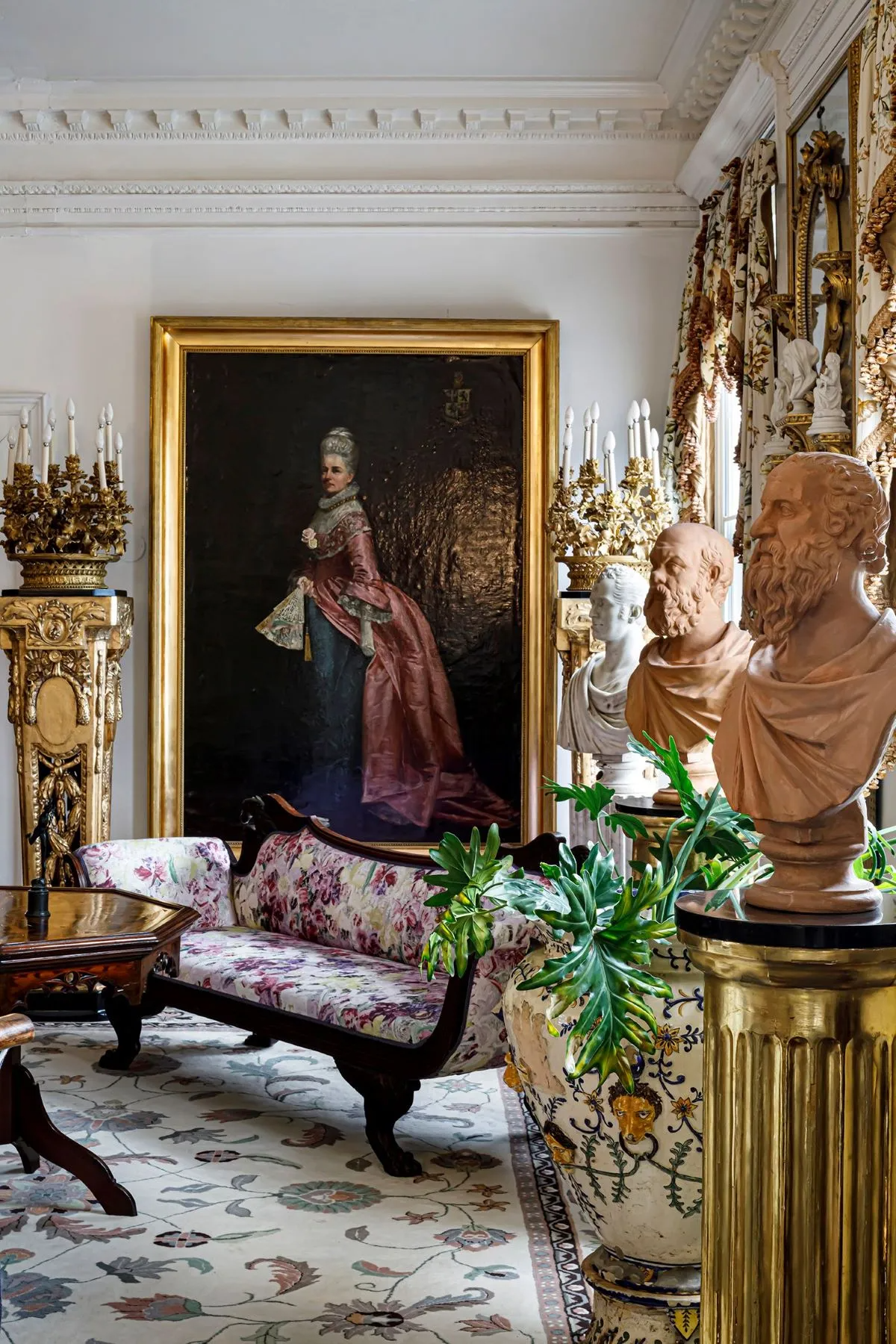 grand entry hall with multiple seating areas, plasterwork, wood floor,