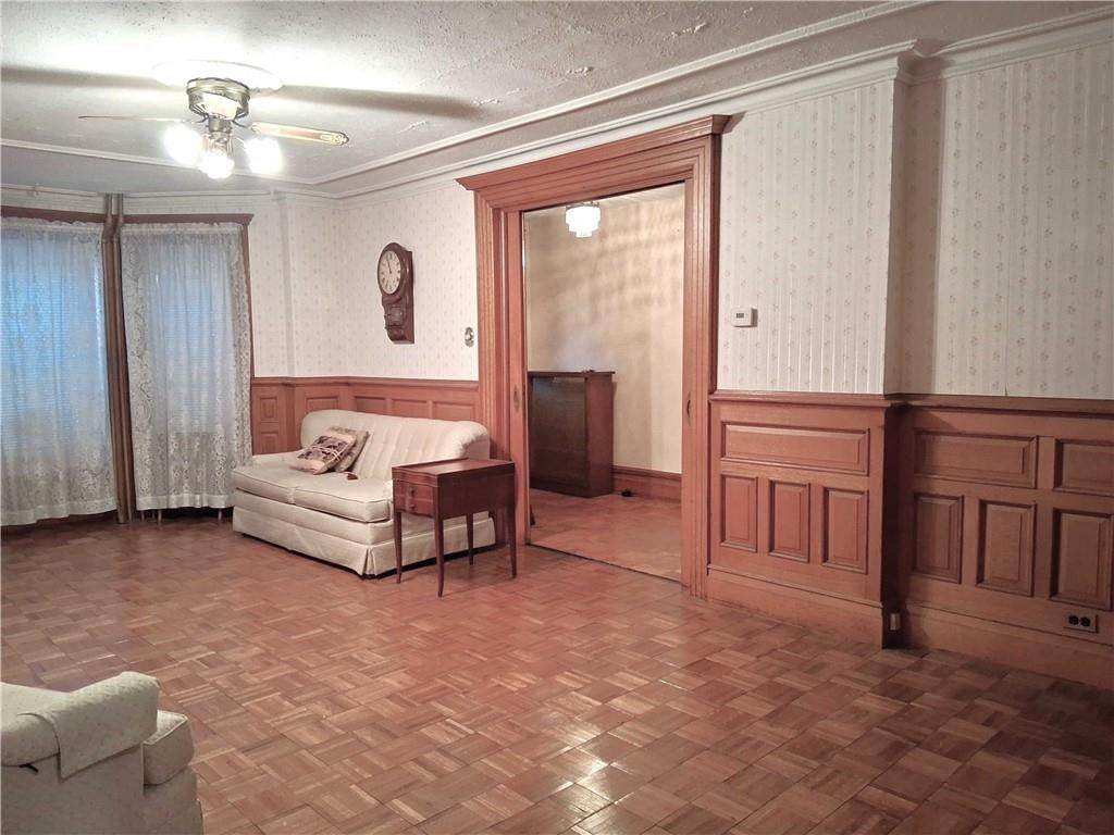 garden level dining room with wainscoting wallpaper