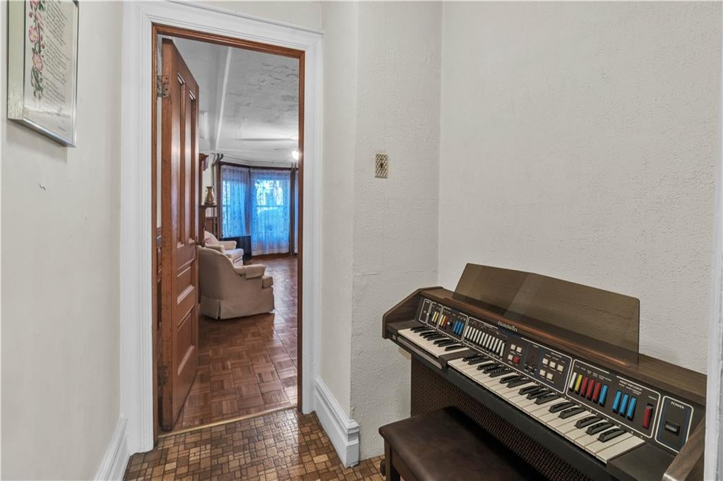 pantry off dining room with a keyboard