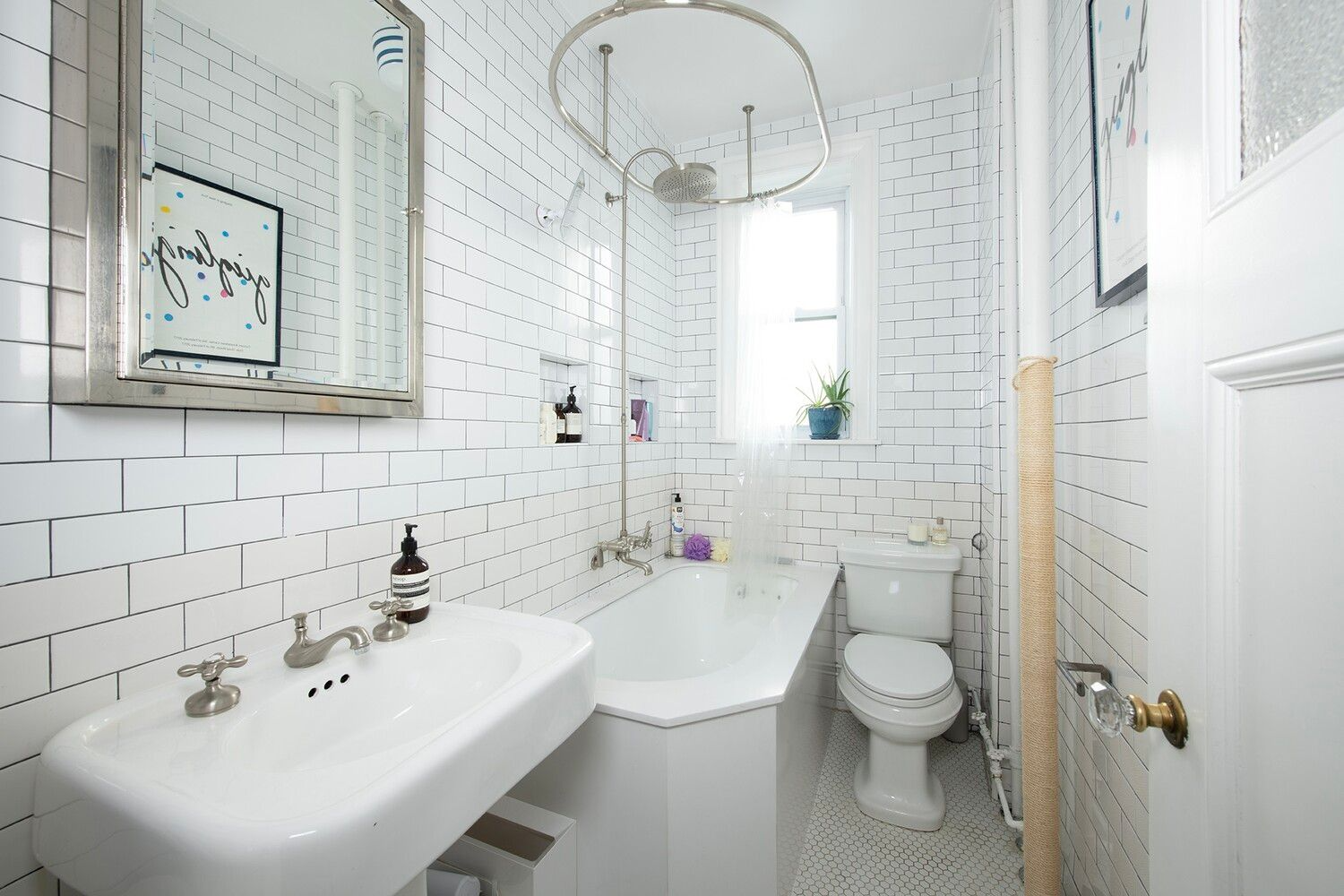 bathroom with white fixtures, tile