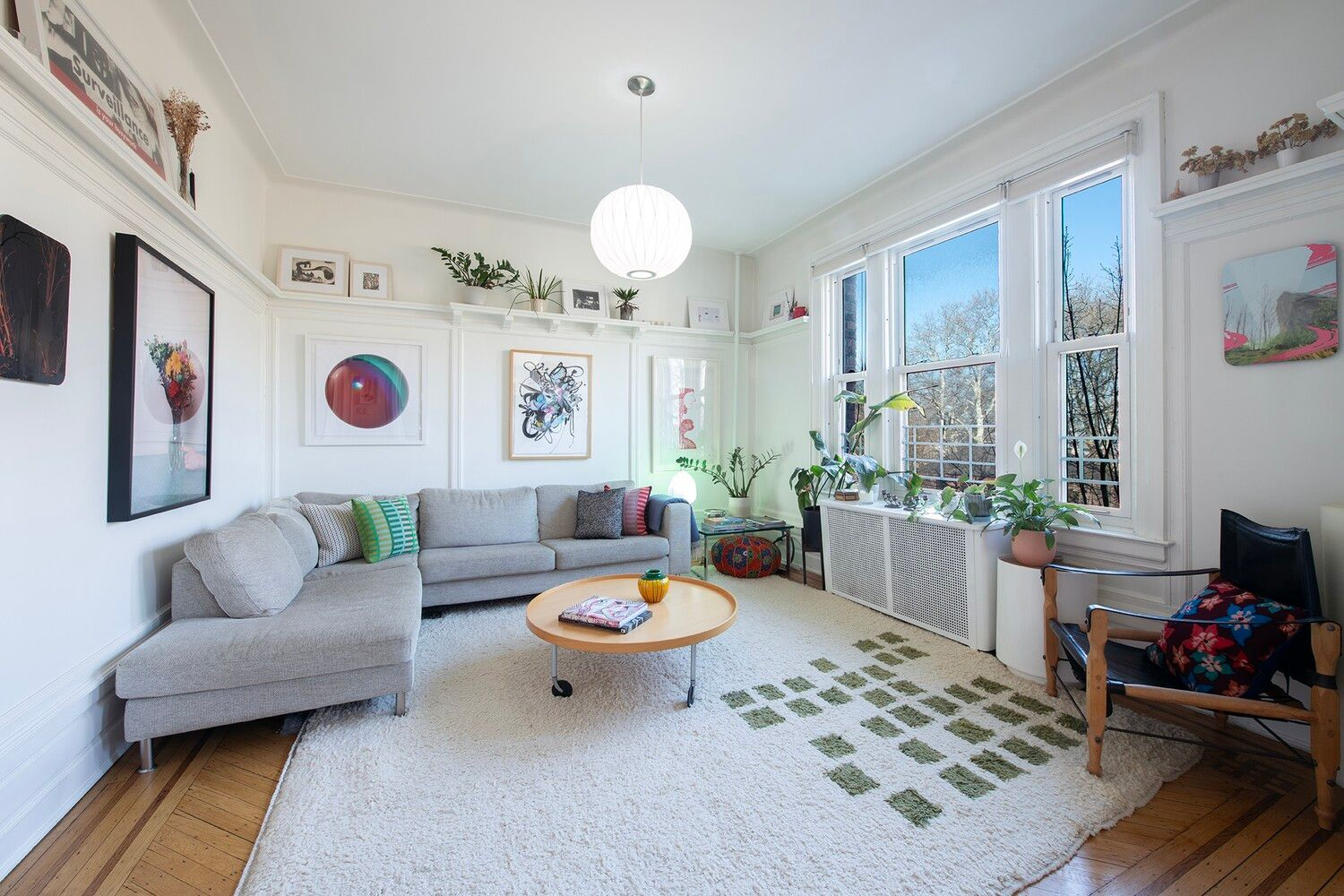 living room with wood floor, white walls