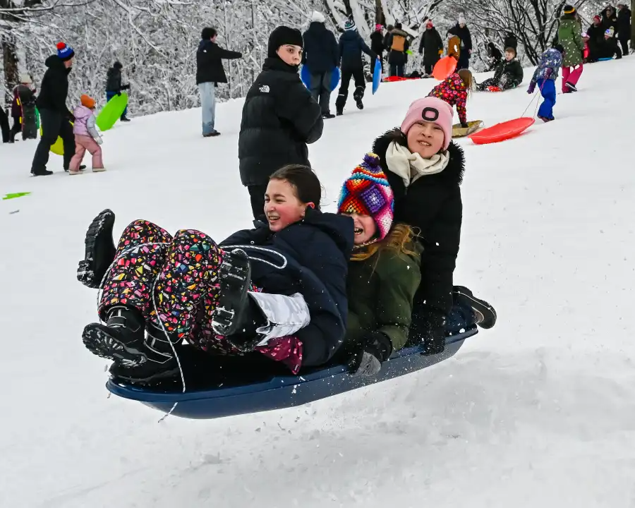 people on a blue sled