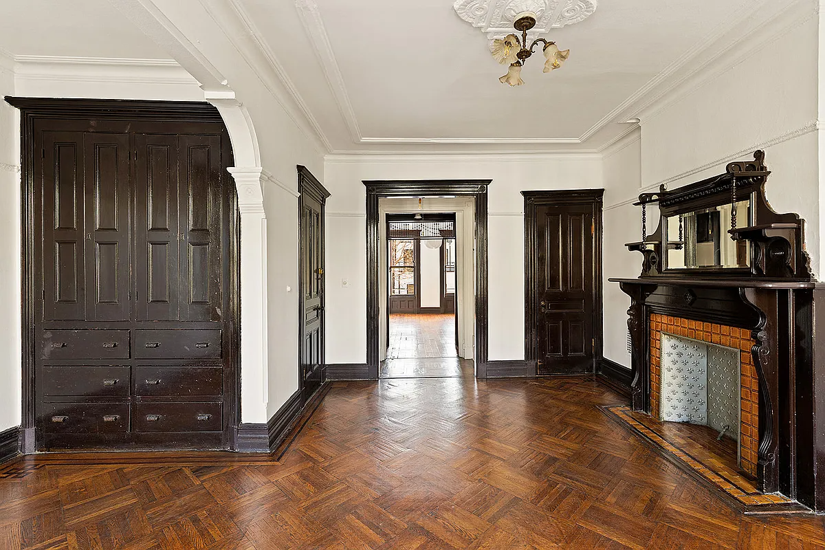 room with wooden fireplace, built-in