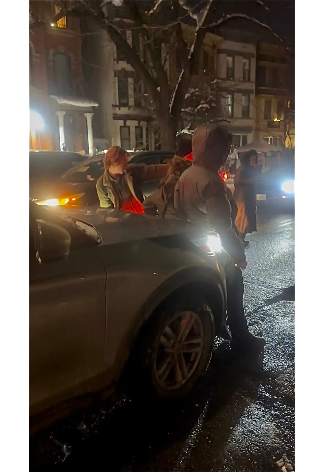 people in the street at night