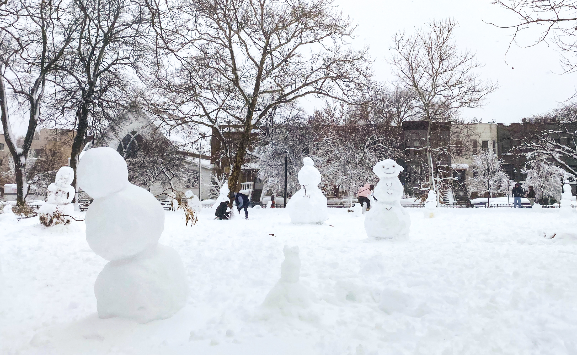 snowy park filled with snow sculptures