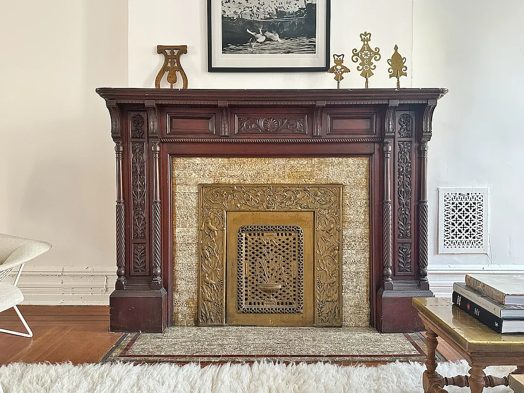 wooden fireplace with original tile edge
