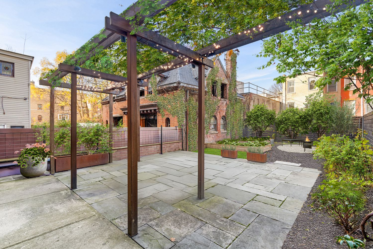 virtually staged rear yard with patio, pergola, fire pit