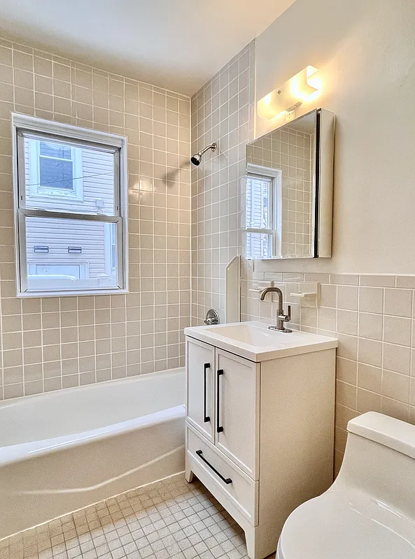 bathroom with beige tile