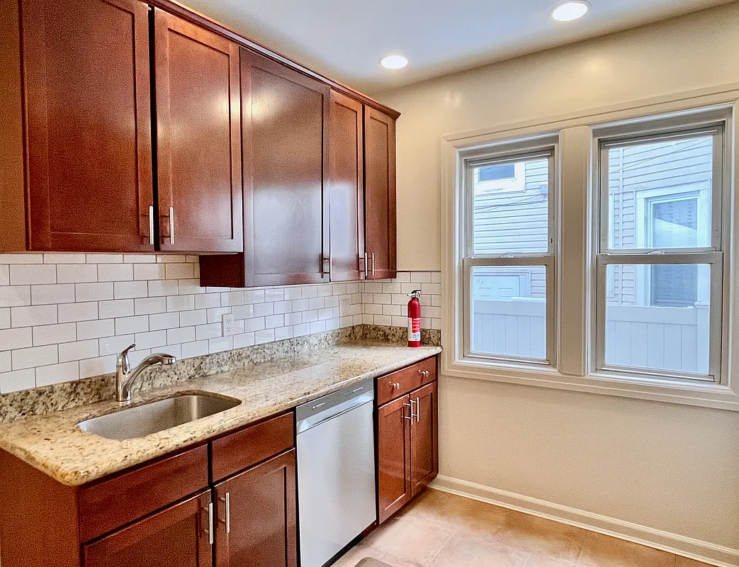 kitchen with wood cabinets, a dishwasher