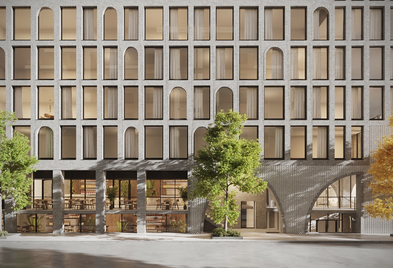 rendering of pal brick building with some arched windows and entries