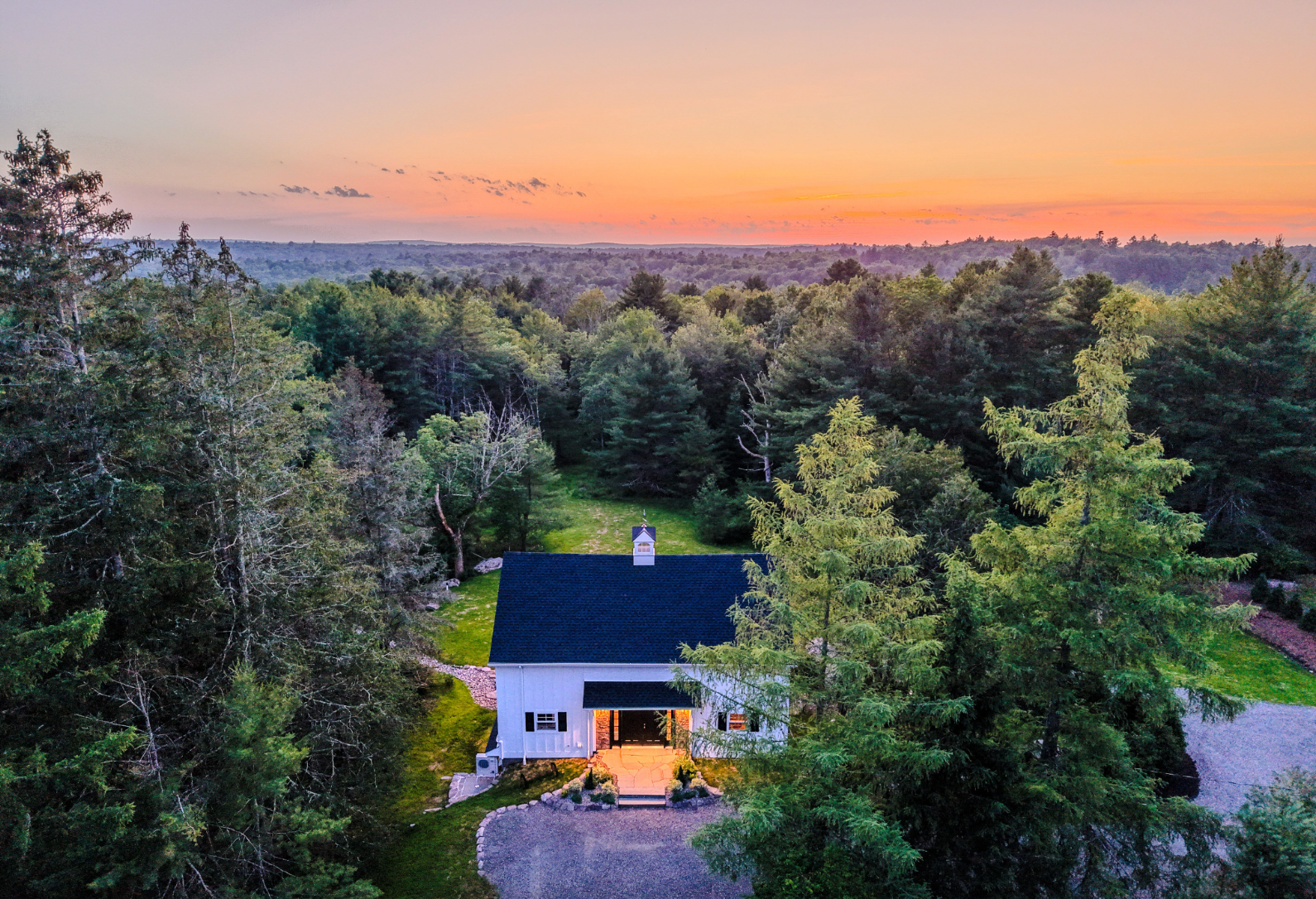 aerial view of a house amidst the trees