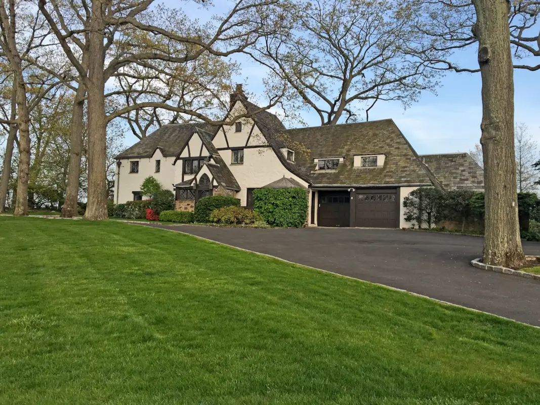 exterior of the house showing garage wing and a driveway