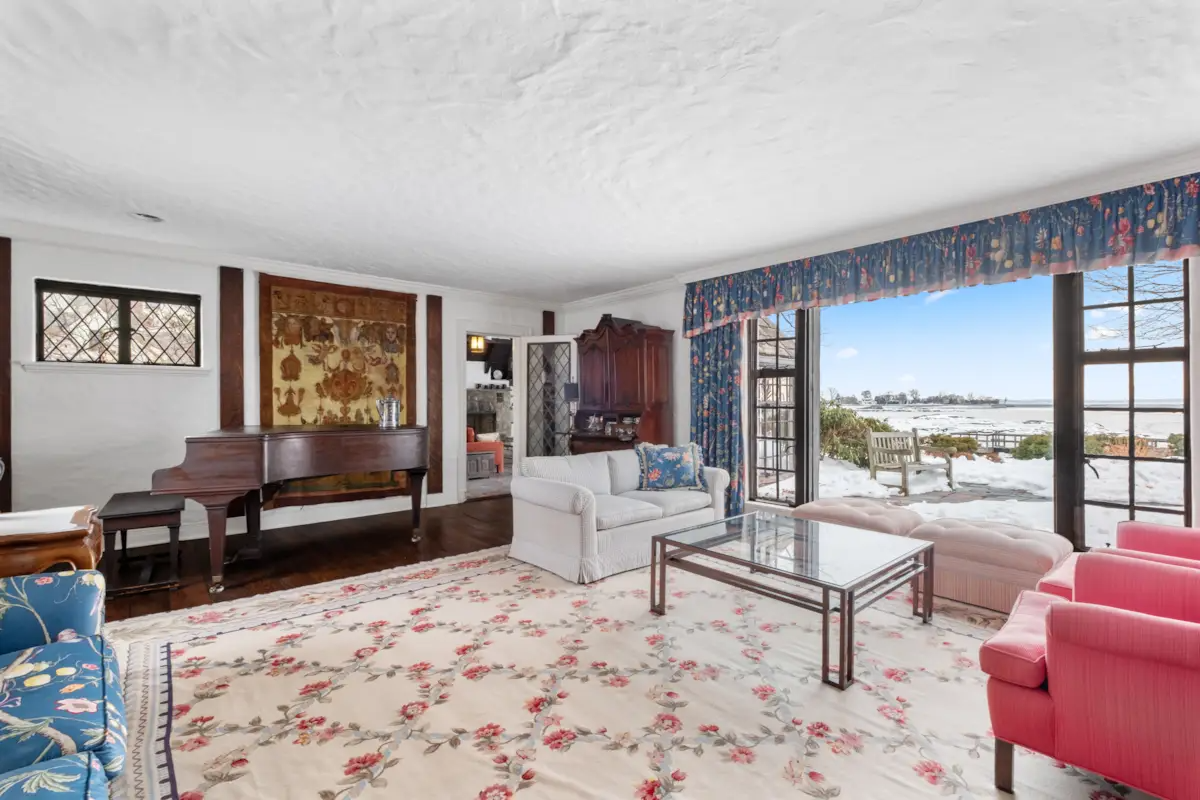 living room with large windows with waterfront views