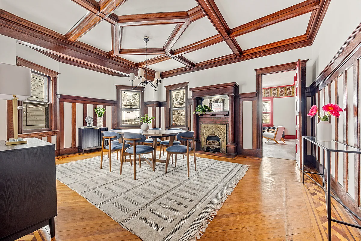 dining room with mantel, wainscoting