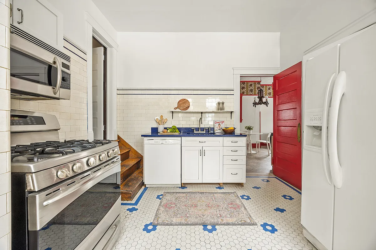 kitchen with vintage white subway tile with a blue border on walls