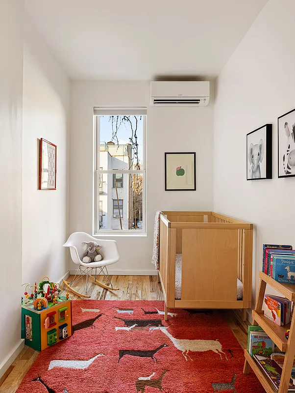 bedroom with a mini split set up as a nursery