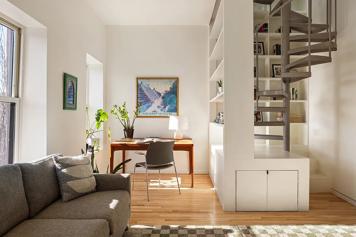 spiral staircase built into a bookshelf