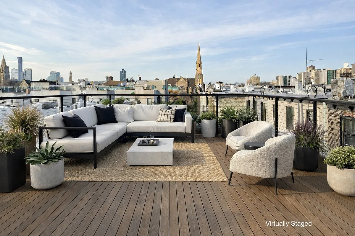 virtually staged room with wood deck, railing and seating area