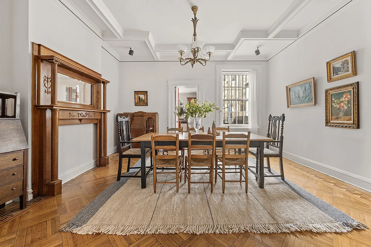 rear parlor as dining room with wood mantel