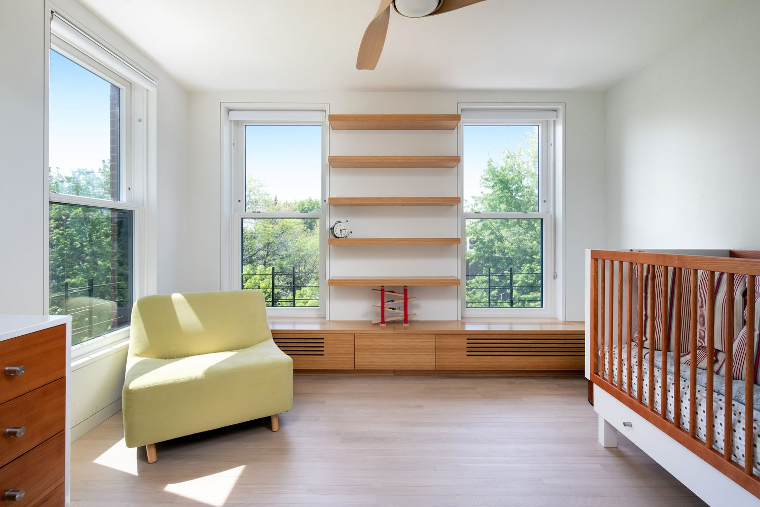 bedroom with two exposures and built-ins under window