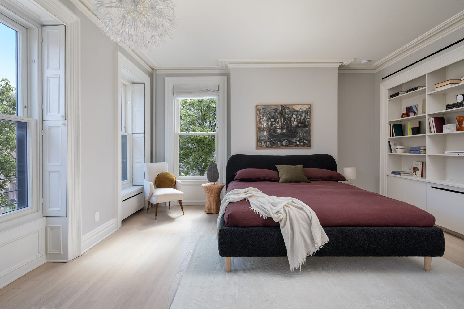 bedroom with modern built-ins, two exposures