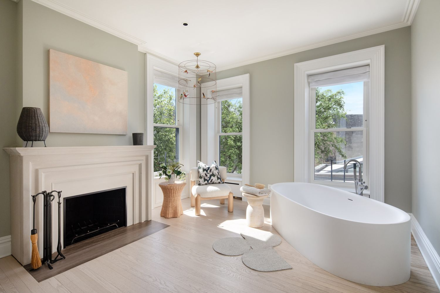dressing room with modern mantel and a soaking tub