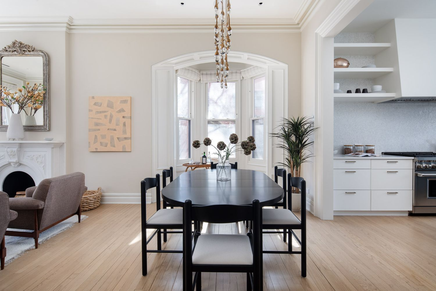 dining area with arched nook and view into kitchen