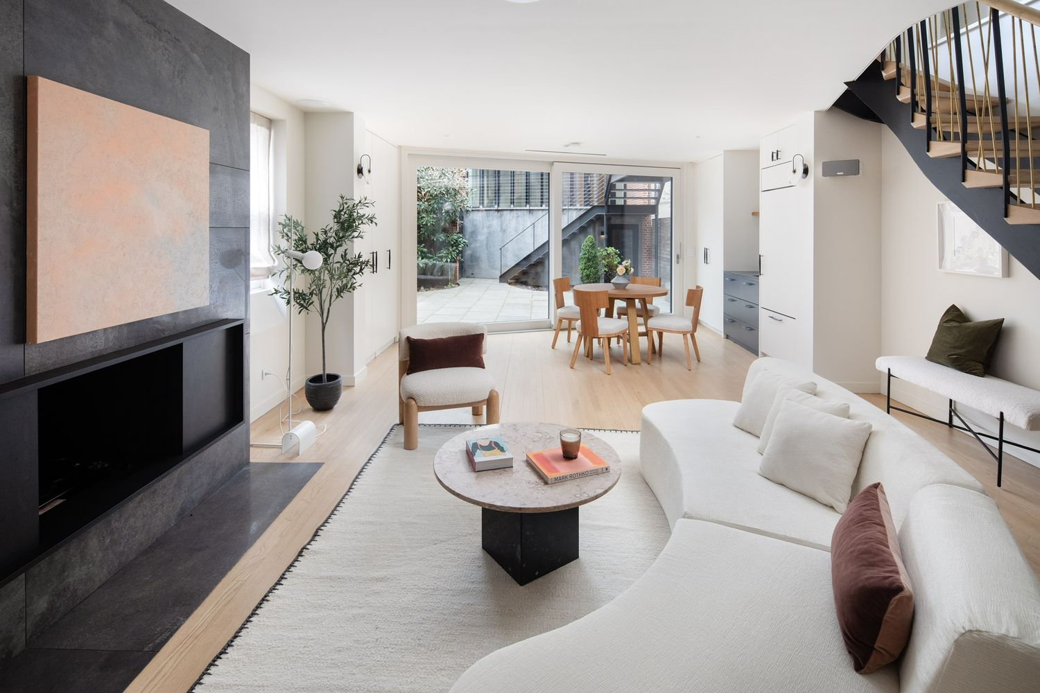 living room with wall of glass and view to rear yard