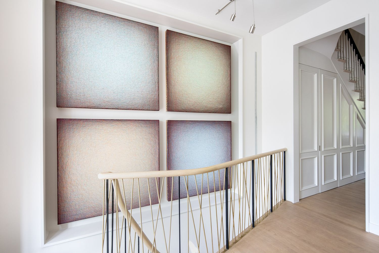 hall with modern staircase and white walls