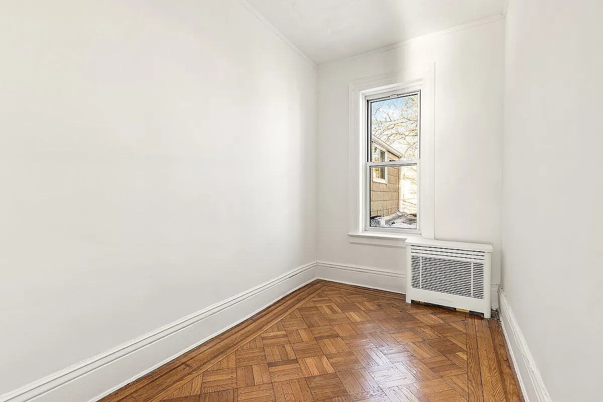 narrow bedroom with one window