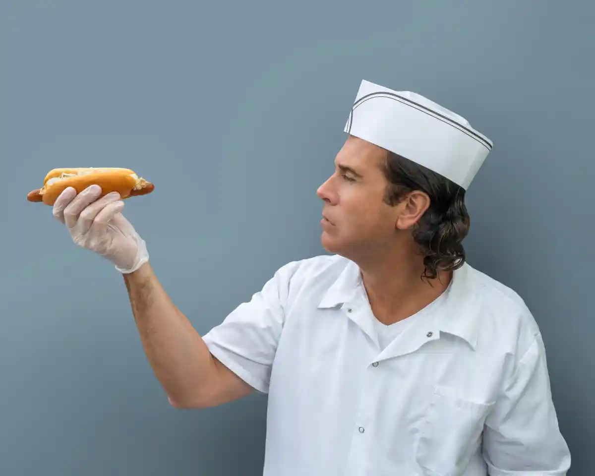 person looking at a hot dog
