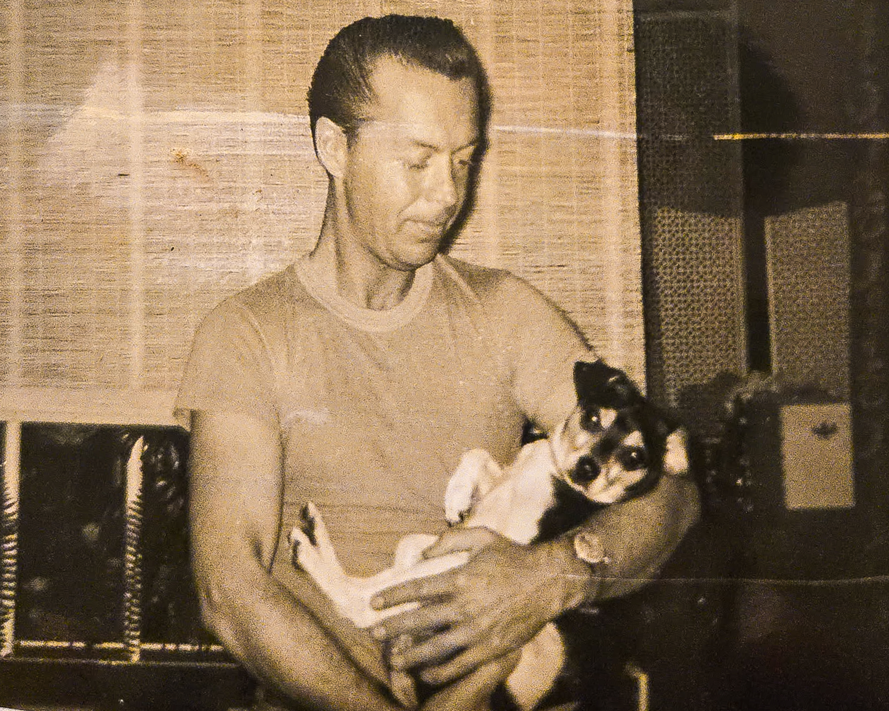man holding a dog