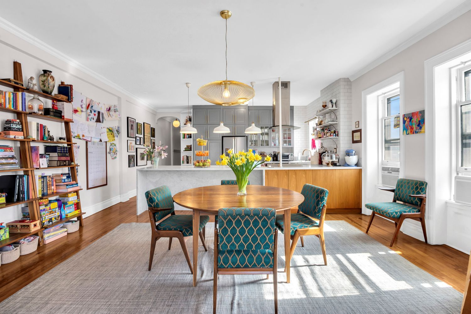 open plan kitchen and dining room with a wood floor