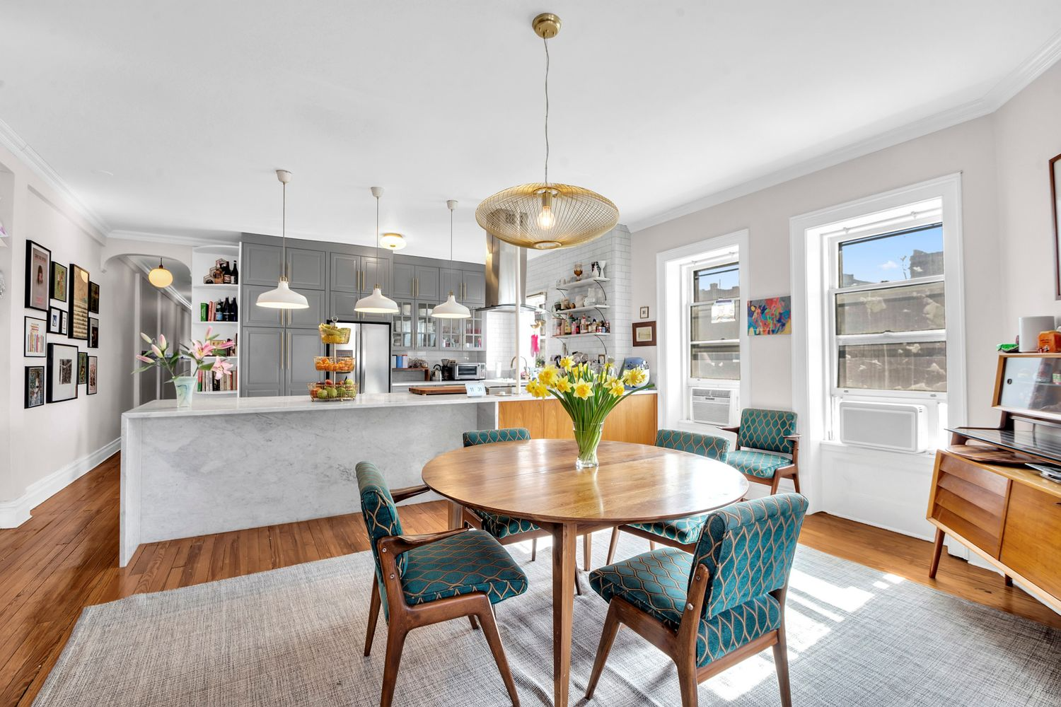 open plan kitchen and dining room with a wood floor