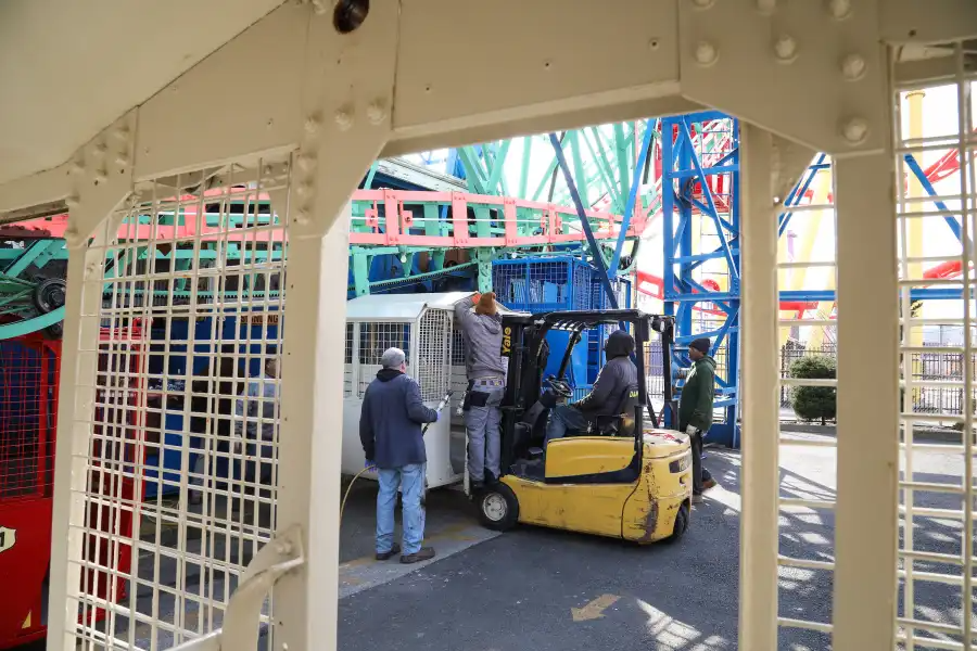crew working on a car of the wonder wheel
