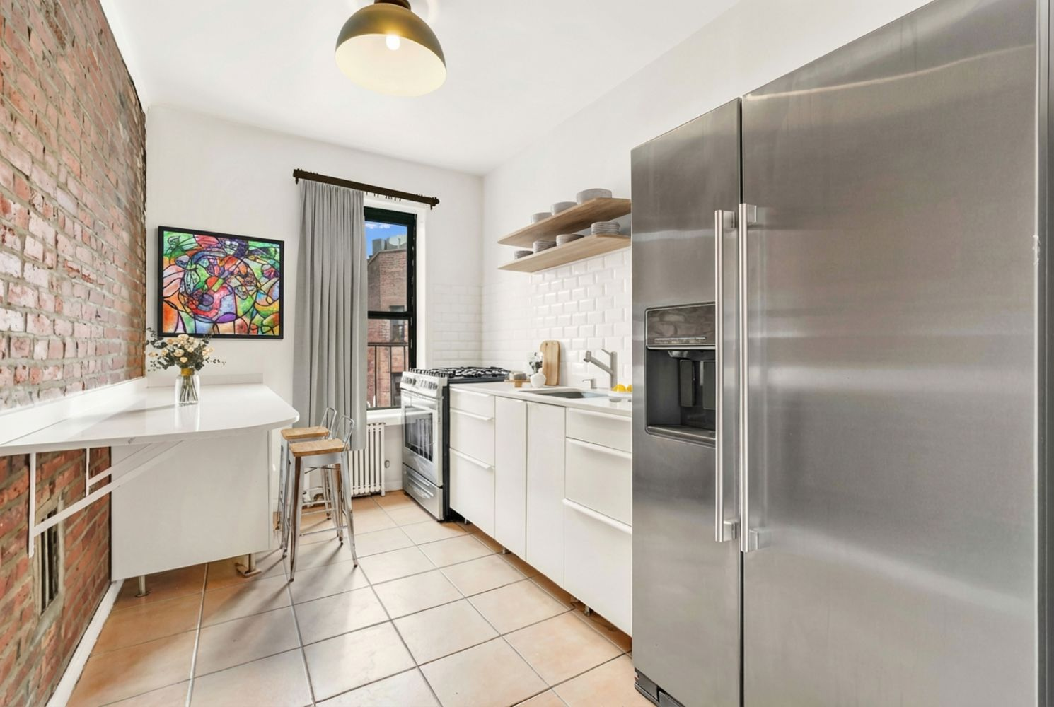 kitchen with tile floor, white cabinets